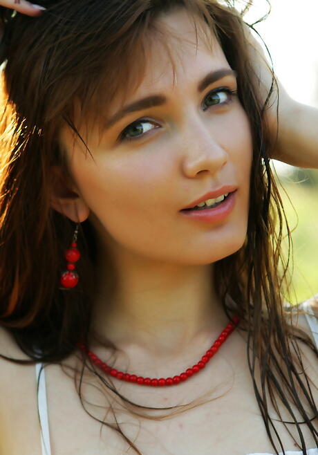 Gracile youthful Aria Bella bares small tits and sexy ass outdoor